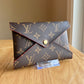 Monogram Kirigami Pochette (Medium)