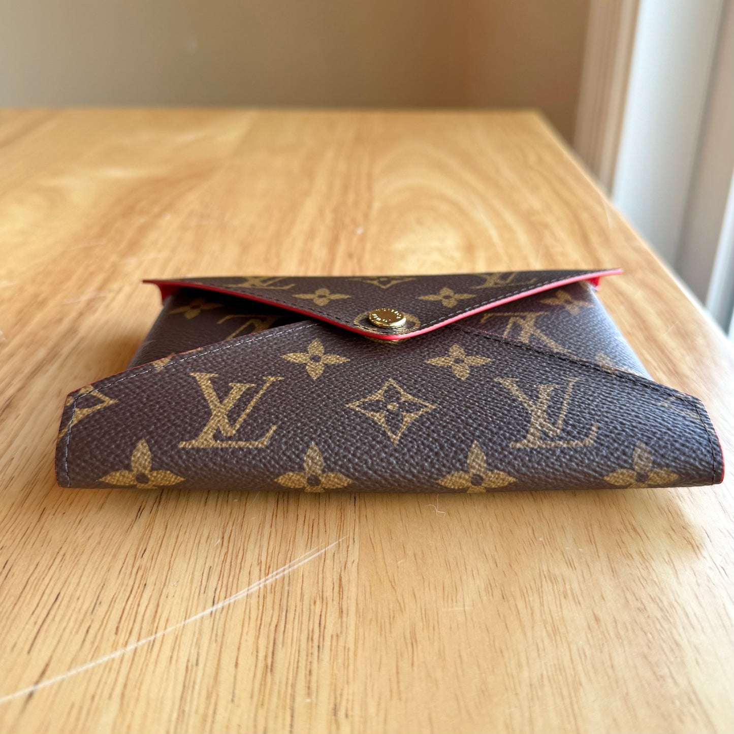 Monogram Kirigami Pochette (Medium)