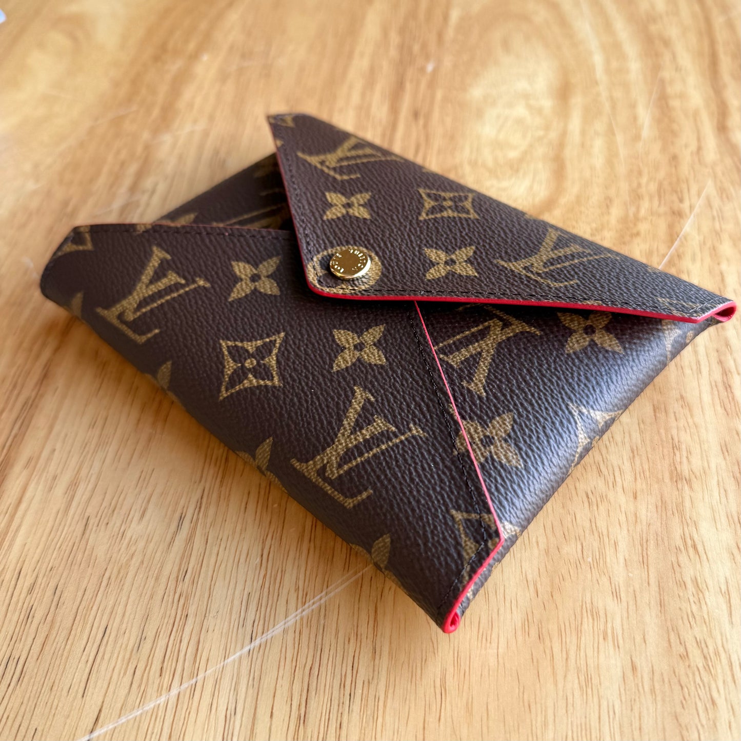 Monogram Kirigami Pochette (Medium)